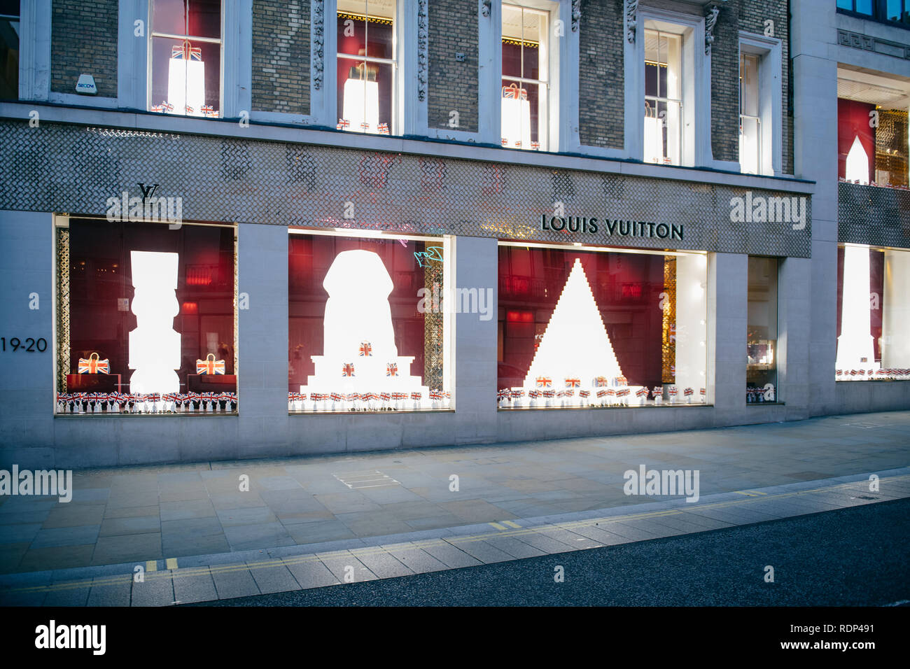 LONDON, UNITED KINGDOM MAY 18, 2018: Louis Vuitton celebrates the wedding of Prince Harry and Ms Meghan Markle with animated British Union Jack flags in their storefront flagship Stock Photo - Alamy