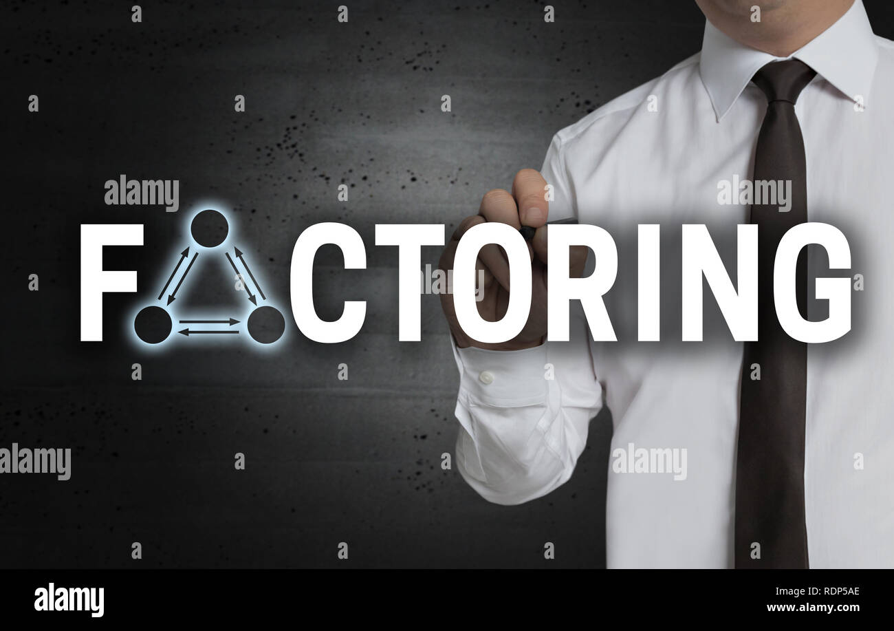Factoring is written by businessman on screen. Stock Photo