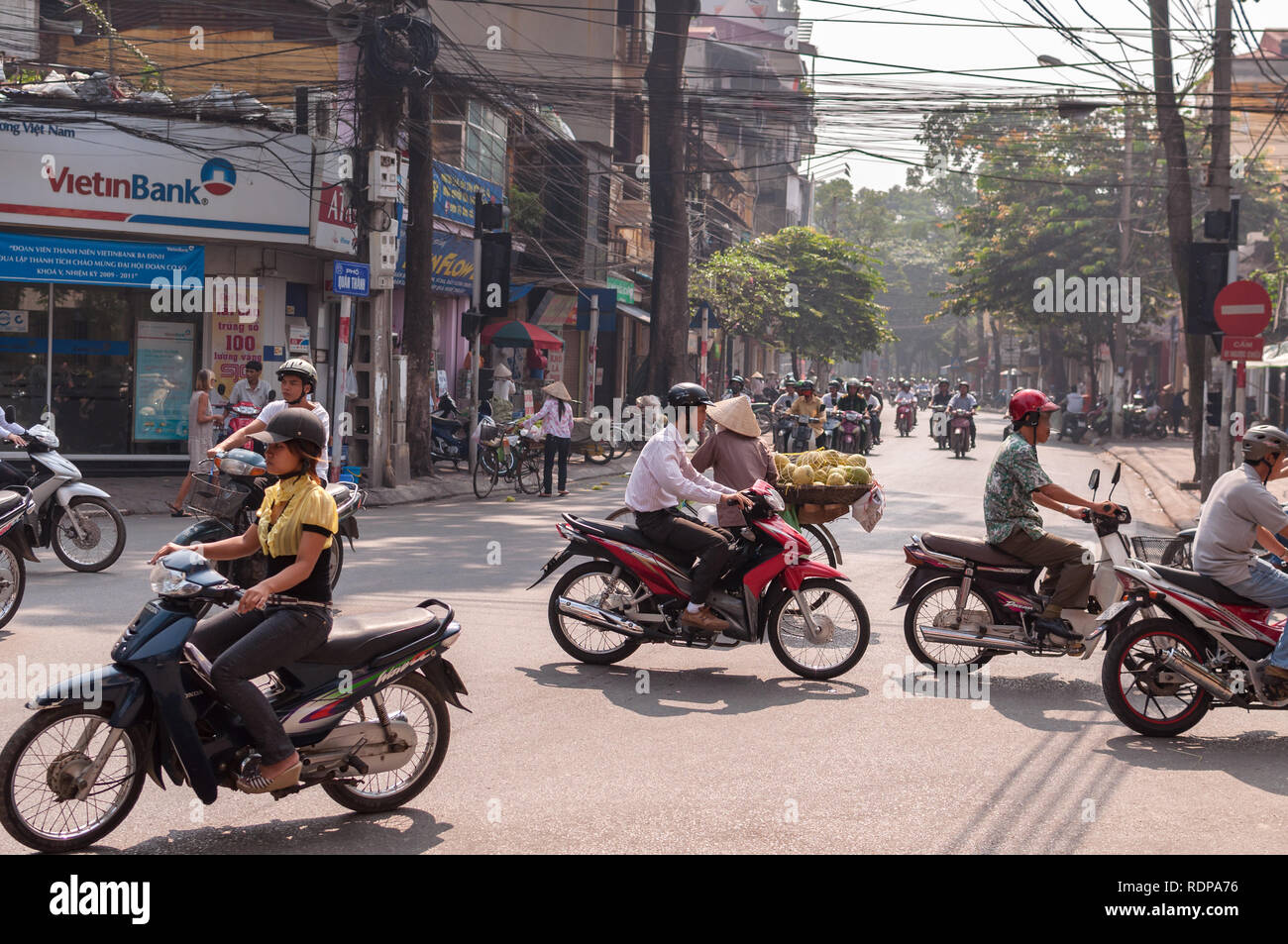 Typical street scene with several mopeds and motorbikes on the road