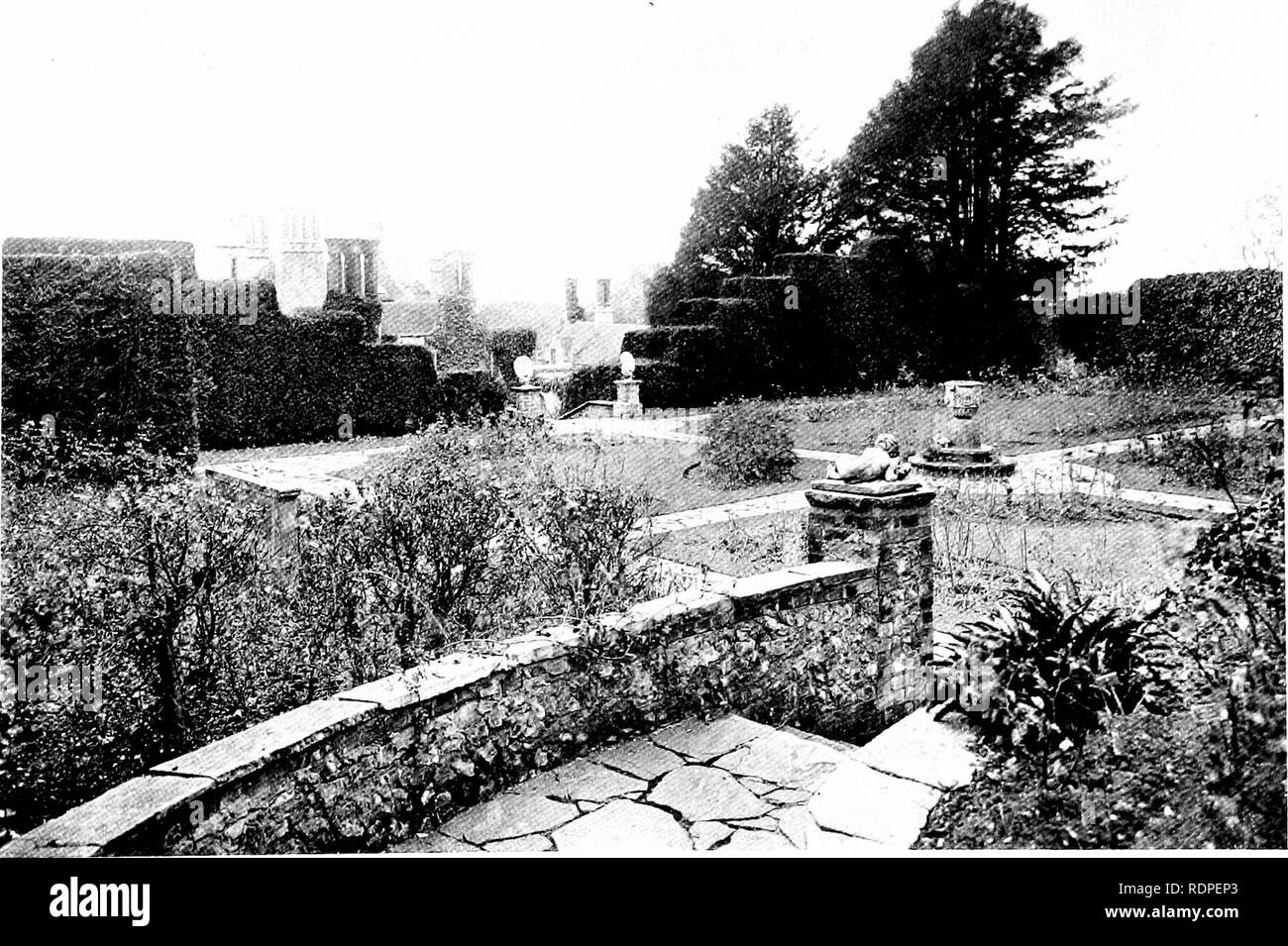 . Gardens for small country houses . Gardens, English. FIG. XV.—SECTION AT N—N. FIG. XIV.—MARKYATE CELL: SECTION OF GARDEN AT M—M (SEE PLAN) interesting by a pair of leaden peacocks. Above the rose garden is a final terrace, from which delightful views are secured over the whole estate. The obvious method of giving access to it would have been by providing another flight of steps on the main axial line, but the obvious in garden design is often dreary. Considerable variety has been achieved by providing a series of steps, curved on plan, which wind from the south-east corner of the rose garden Stock Photo