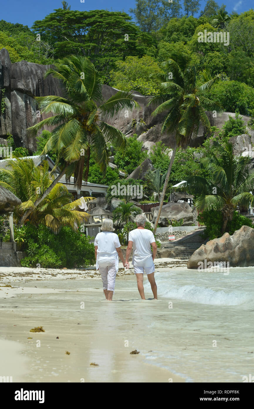 Happy family walking on beach hi-res stock photography and images - Alamy