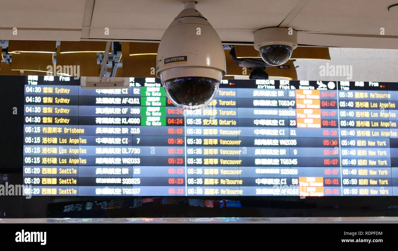 Taoyuan, Taiwan - November 07, 2018 : Close up of security camera in front of flight schedules board inside Taoyuan international airport in Taoyuan T Stock Photo