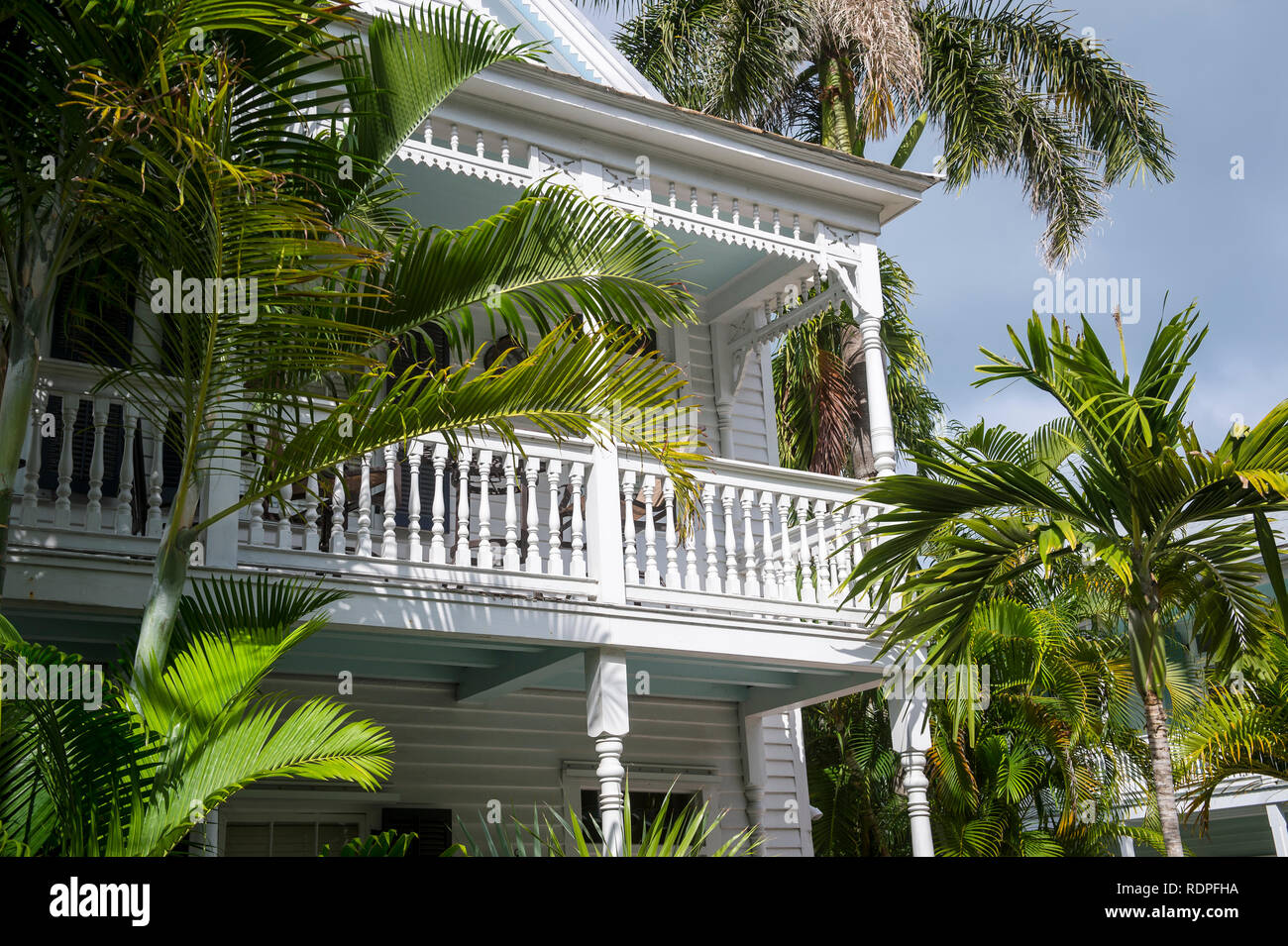 Scenic view of typical wooden conch house with patio overlooking palm-lined  street in Old Town, Key West, Florida, USA Stock Photo - Alamy