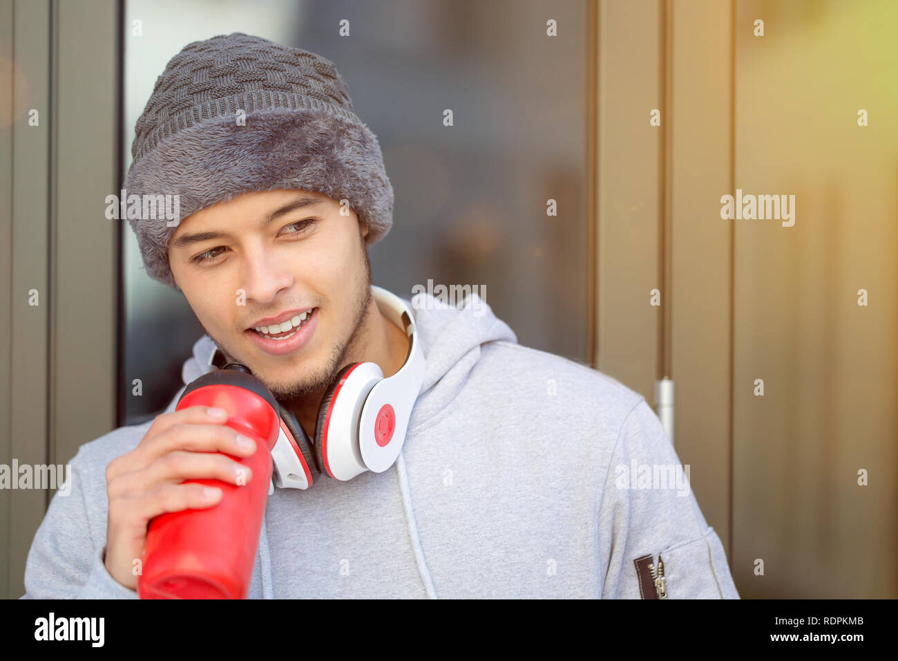 Sports training young latin man drinking water runner copyspace copy space winter running fitness outdoor Stock Photo