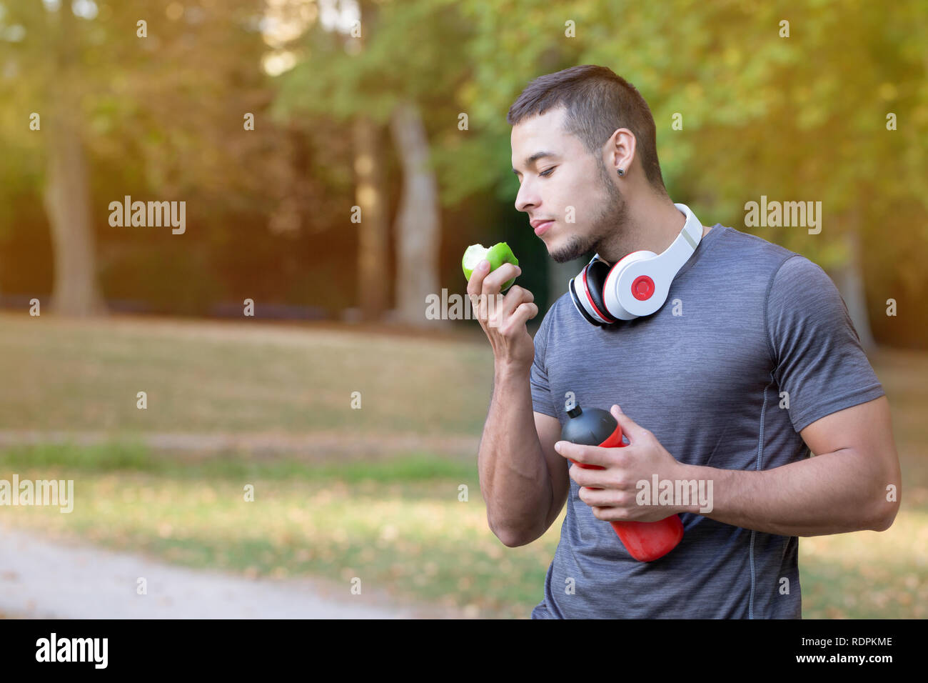 Apple Man Run Man eating apple hi-res stock photography and images - Alamy