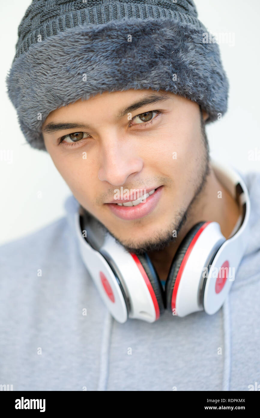 Sports training portrait of a young latin man winter cold portrait format runner outdoor Stock Photo
