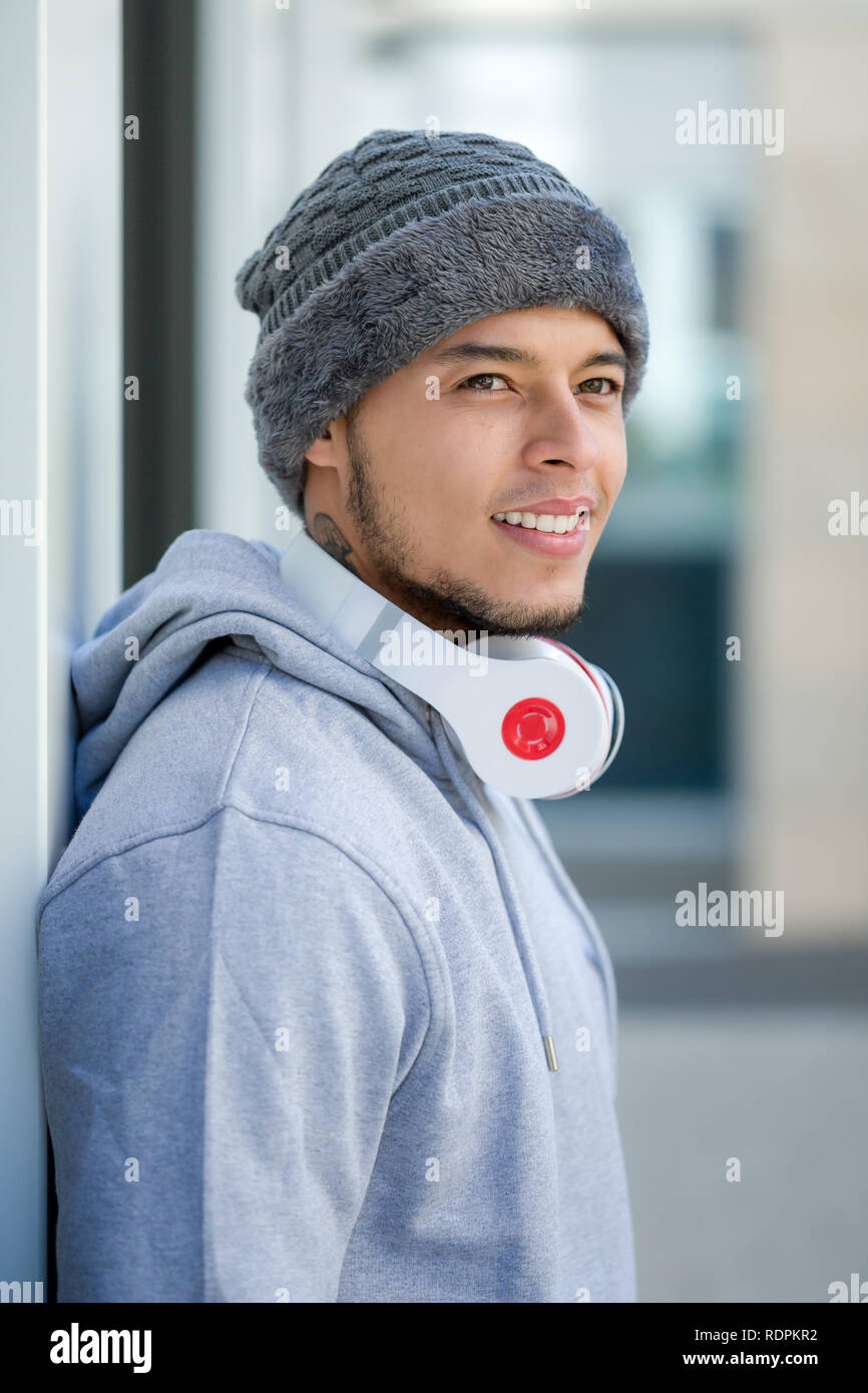 Sports training young latin man winter cold runner portrait format outdoor Stock Photo