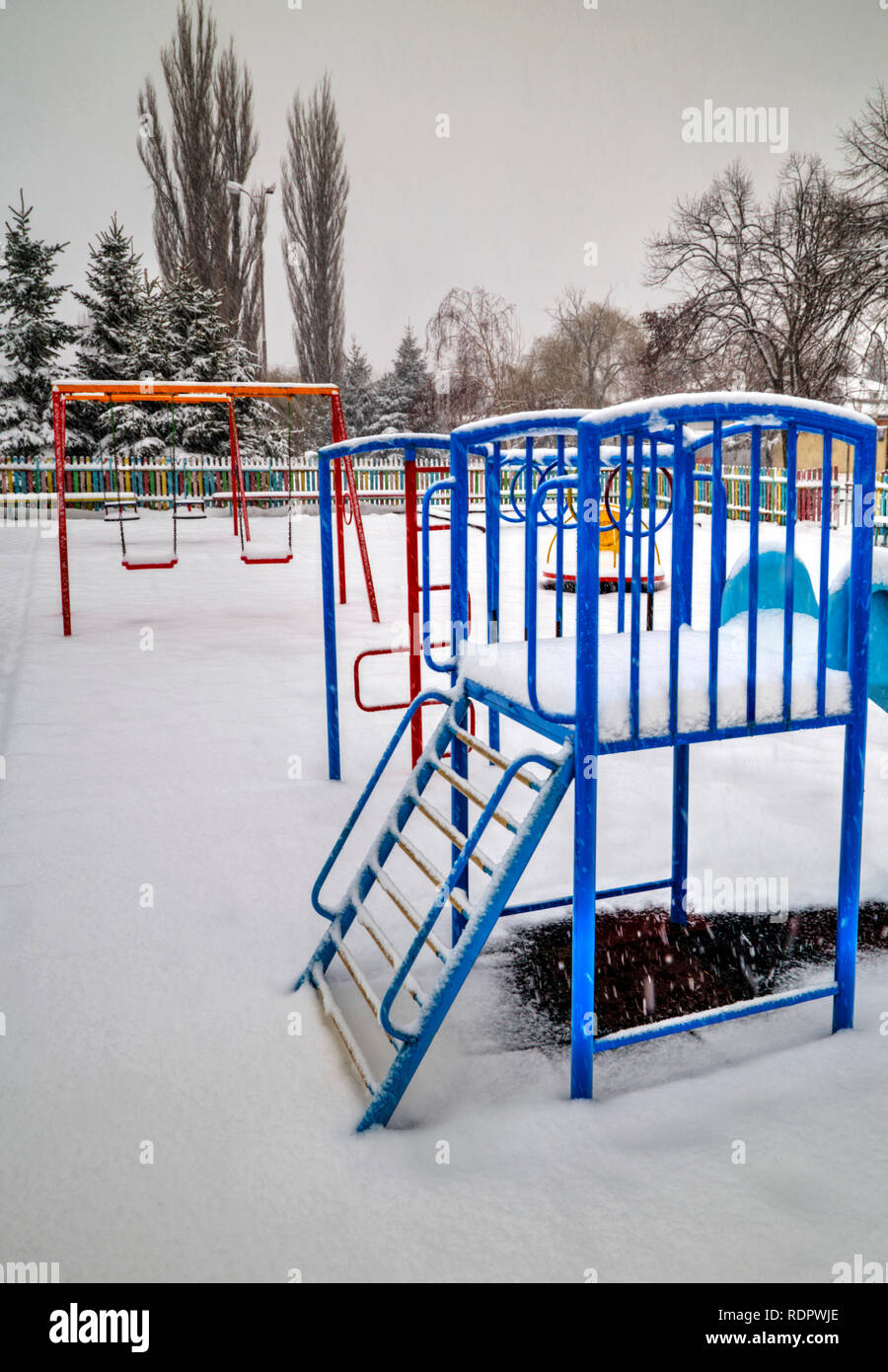 Children's playground covered with snow in winter Stock Photo - Alamy