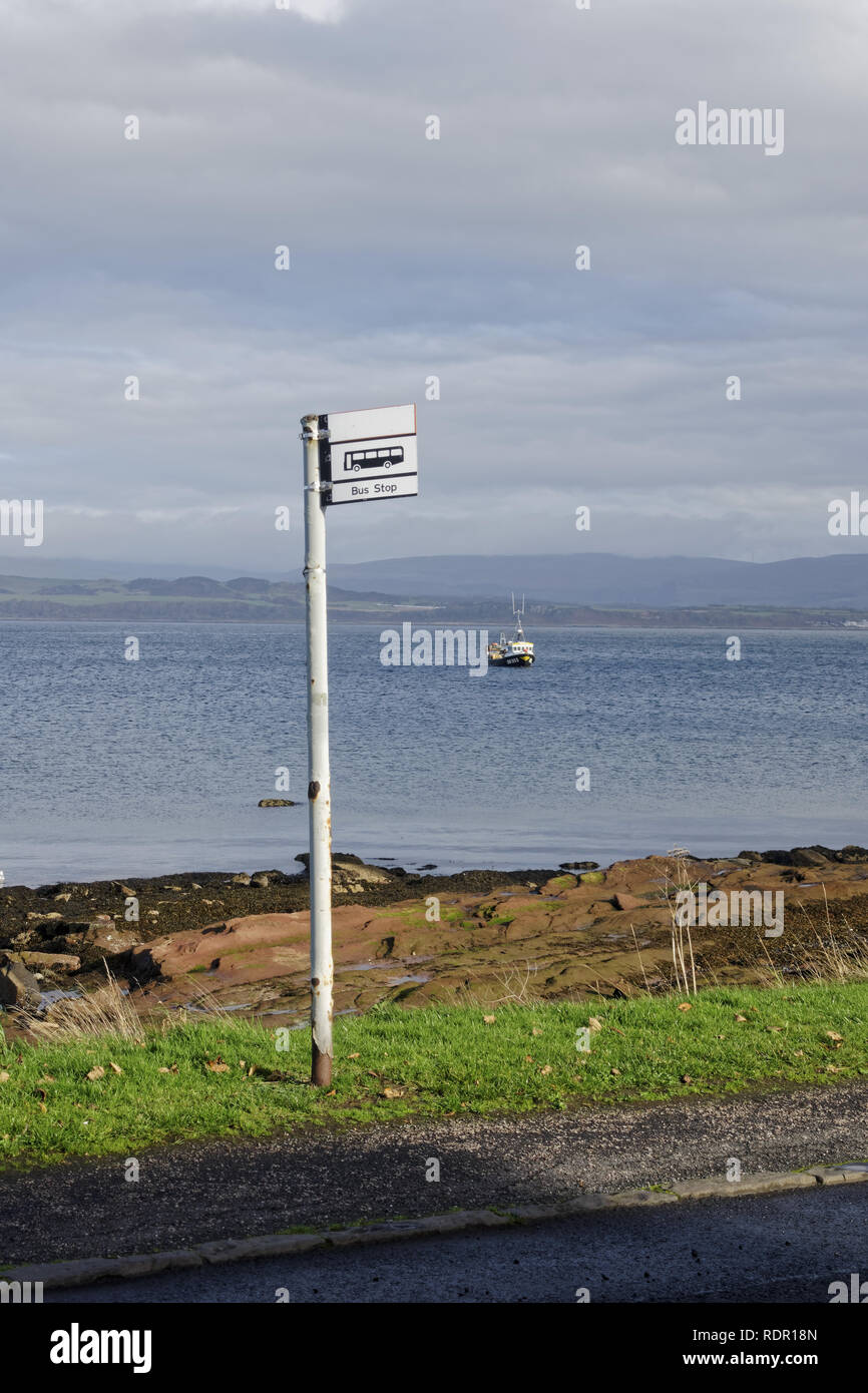 Bus stop next to seaside at Kilchattan Bay, Isle of Bute, Argyll, Scotland, UK Stock Photo