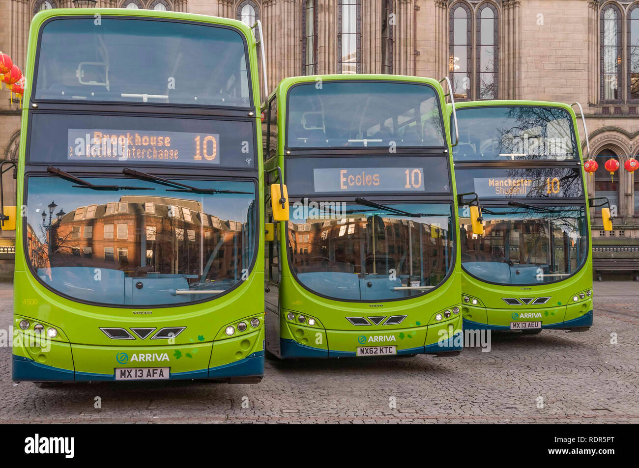 Three new Arriva ECO Hybrid double decker buses at Manchester Town Hall. Stock Photo