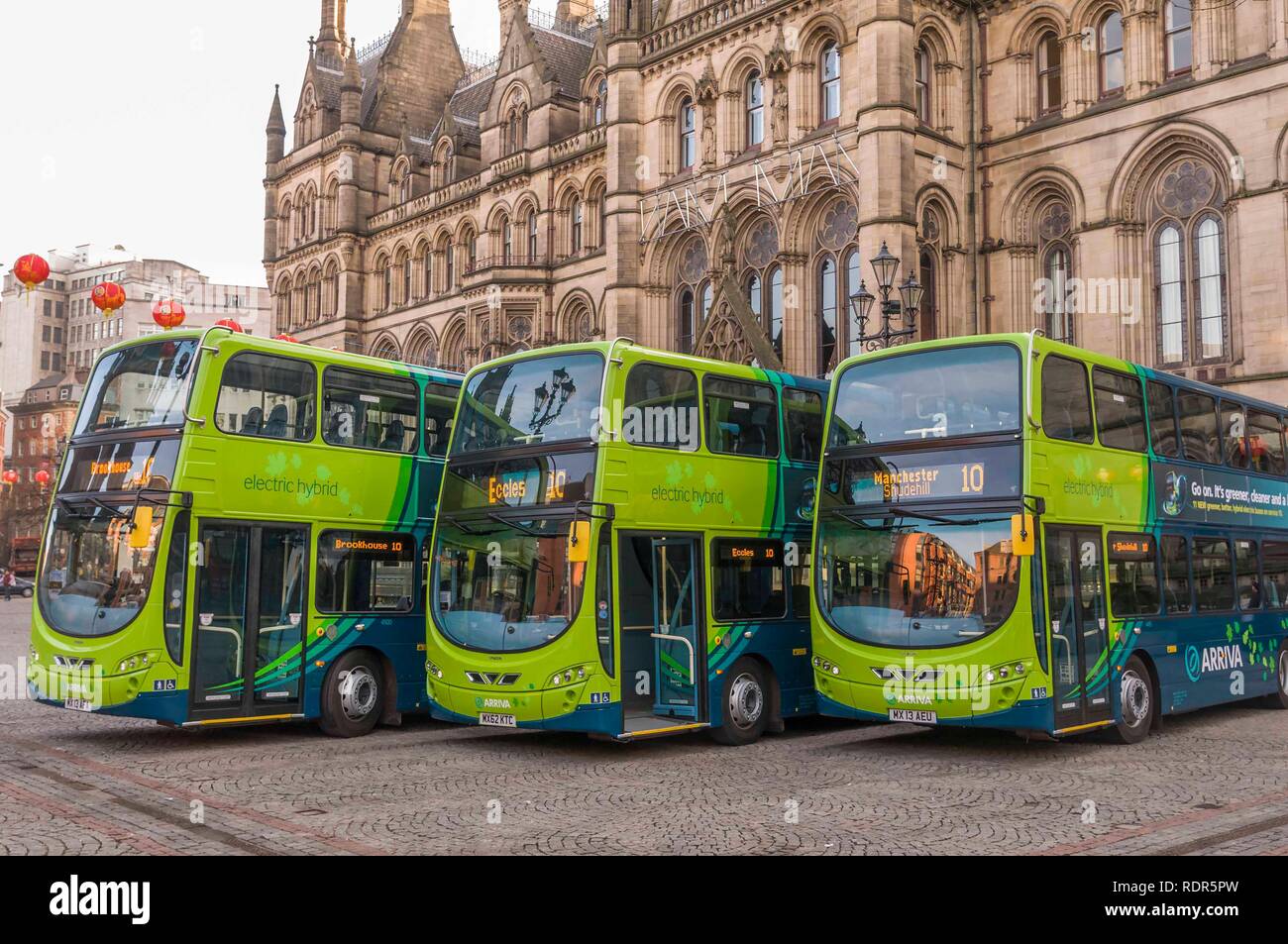 Three new Arriva ECO Hybrid double decker buses at Manchester Town Hall. Stock Photo