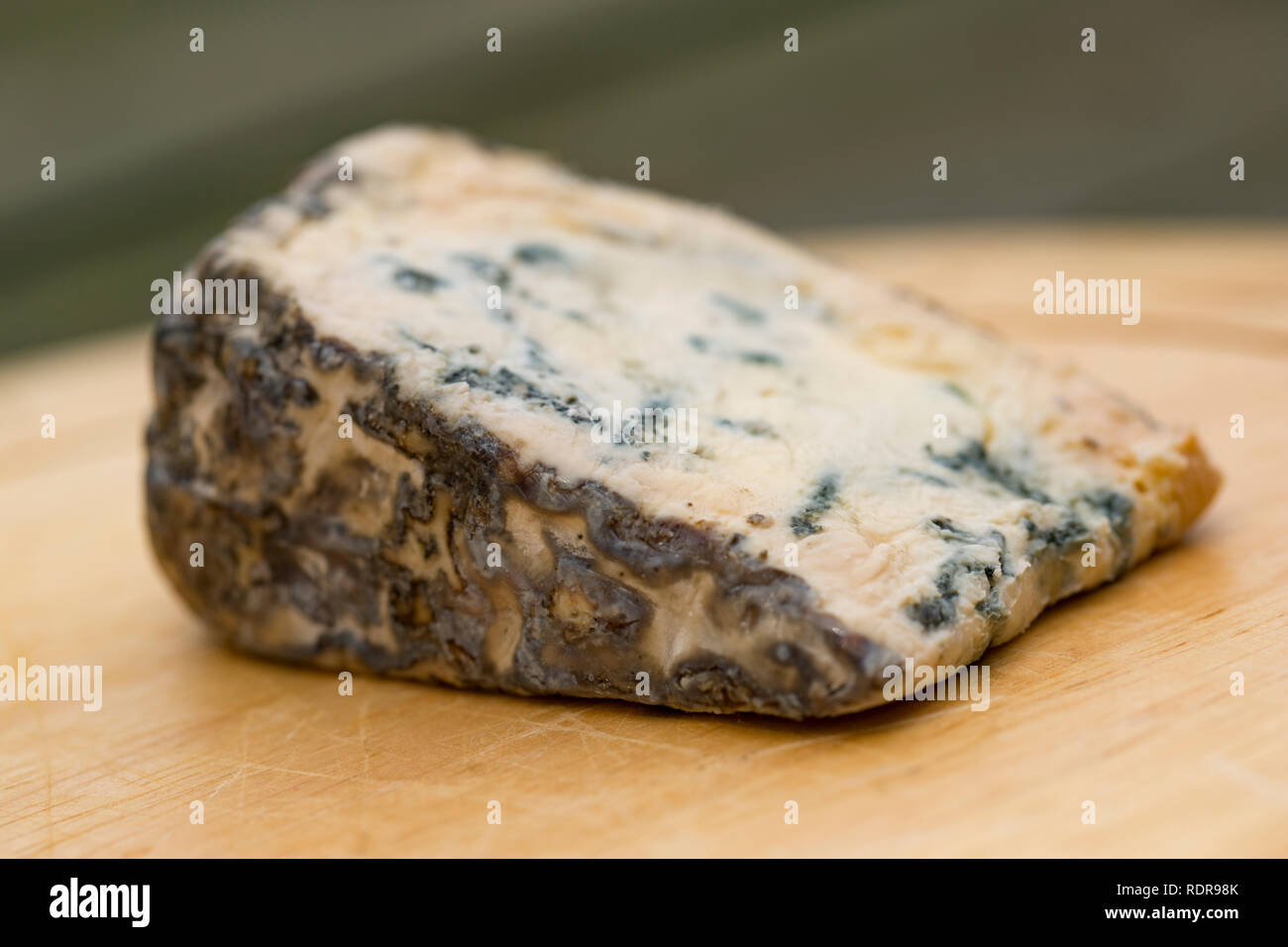 A wedge of Burt’s Blue Cheese made in Cheshire UK and bought from a supermarket in Lancashire England UK GB Stock Photo