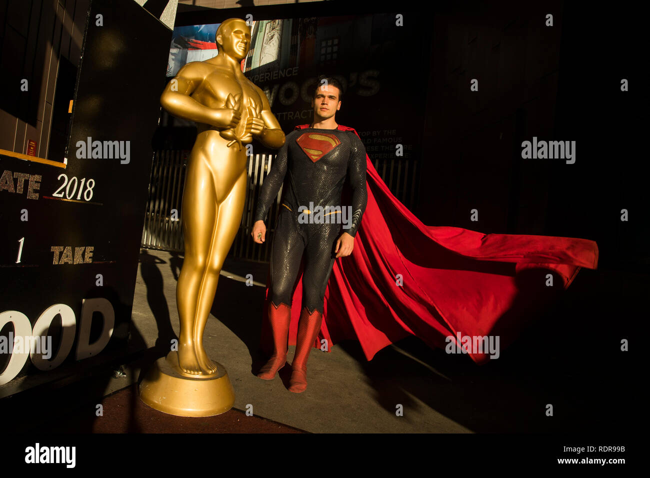 Anatoly dressed as Superman and Oscar statue replica at gift shop