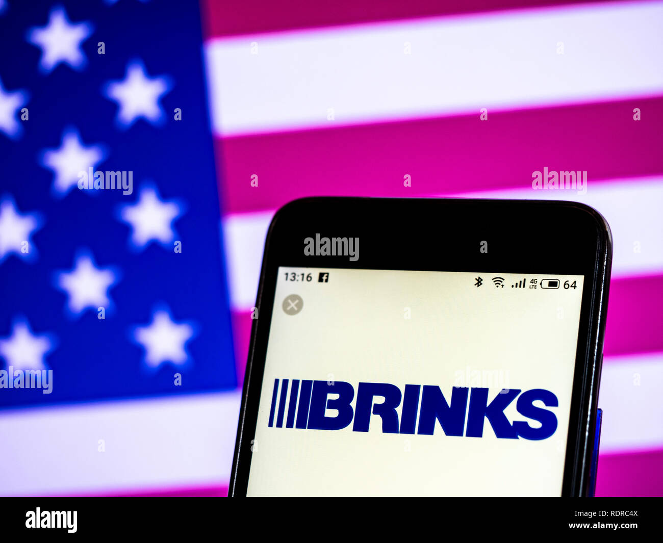 Brink's Security company logo seen displayed on smart phone Stock Photo