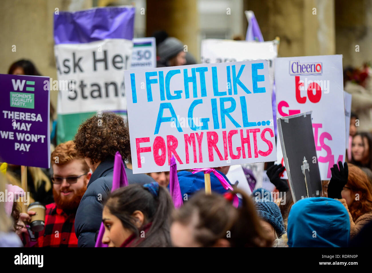 London, UK. 19th Jan, 2019. Signs held aloft during the Women's March in the capital, one of 30 such worldwide marches protesting against violence against women and the negative impact of austerity policies. London's theme this year is 'Bread and Roses', honouring Polish-American suffragette Rose Schneiderman who, in 1911 said 'The worker must have bread but she must have roses too', in response to a factory fire where 146 mainly female garment workers died. Credit: Stephen Chung/Alamy Live News Stock Photo