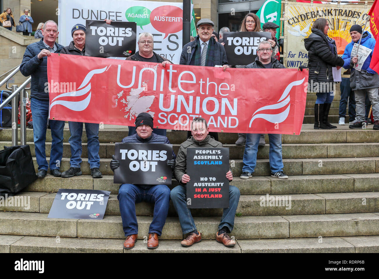 Glasgow, UK. 19th January 2019. Several hundred trades union activists and supporters attended a rally in Buchanan Street, Glasgow as a demonstration against government cuts to local services resulting in the loss of almost 50,000 jobs. Several unions were represented including UNITE, UNISON,RMT, PCS and the PRISON OFFICERS UNION Credit: Findlay/Alamy Live News Stock Photo