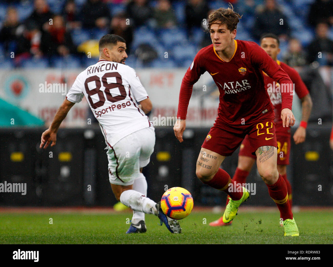 Rome, Italy, 19th January, 2019. Roma's Nicolo' Zaniolo, right, is challenged by Torino's Tomas Rincon during the Serie A soccer match between Roma and Torino at the Olympic Stadium. Roma won 3-2. © Riccardo De Luca UPDATE IMAGES/ Alamy Live News Stock Photo