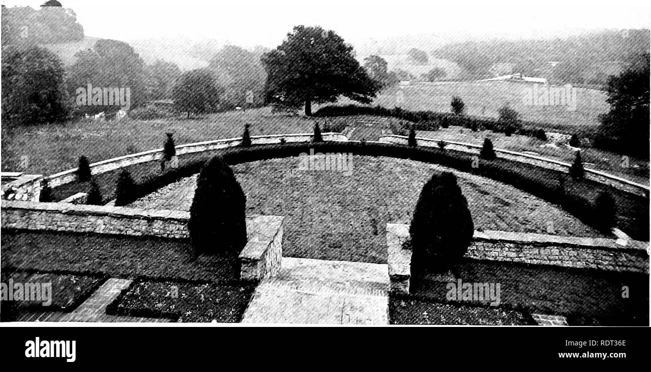. Gardens for small country houses . Gardens, English. 84 On Hillside Gardens. Another interesting treatment of a hillside site is shown in the photograph and plan (Figs, no and in) of a garden at Steep, designed by Mr. Inigo Triggs. In the front of the house is a terrace twenty-five feet wide, with steps leading down to a semi-circular grass terrace bordered by yew hedges. The next lower level is occupied by two flower borders divided by a grass path. From the end of the latter another flight of steps leads down to a green walk, which is enclosed on each side by yew hedges. This slopes down t Stock Photo