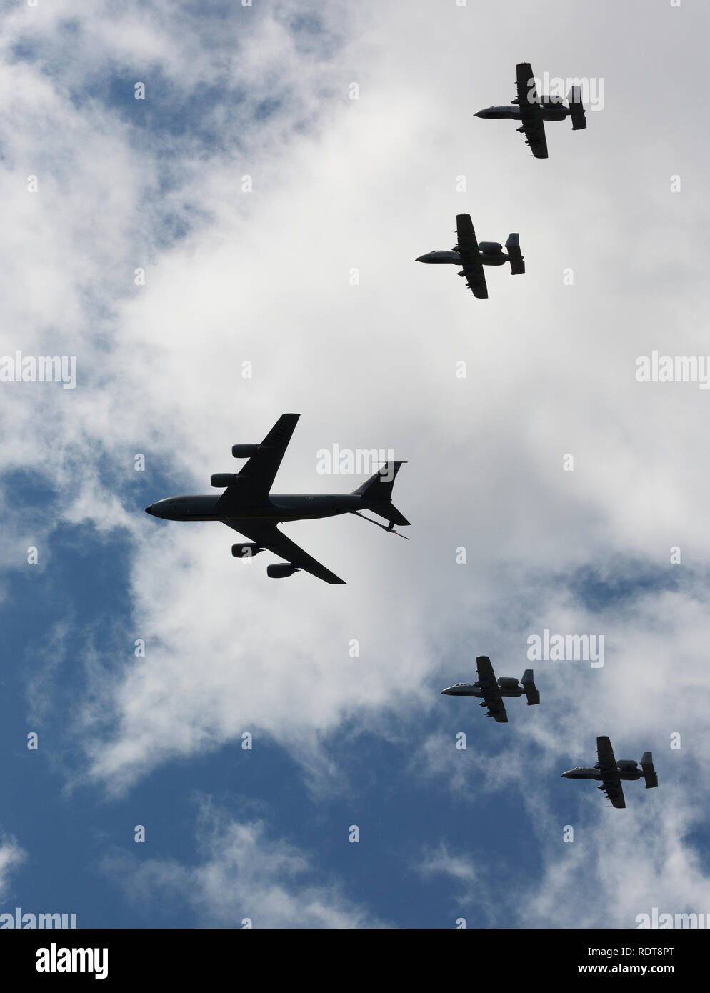 Boeing KC-135 Stratotanker refueling jet with A-10 Warthogs in formation for refueling demo in air show Stock Photo