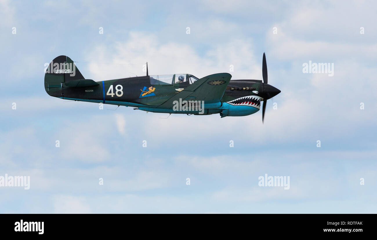 Curtiss P-40 Warhawk also known as The Flying Tiger flying in air show Stock Photo