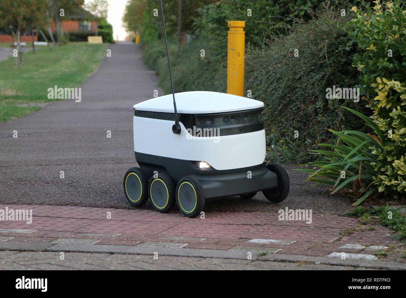 A Starship Technologies delivery robot roams the footpaths in Milton Keynes, delivering groceries from Co-op and Tesco to tech savvy consumers. Stock Photo