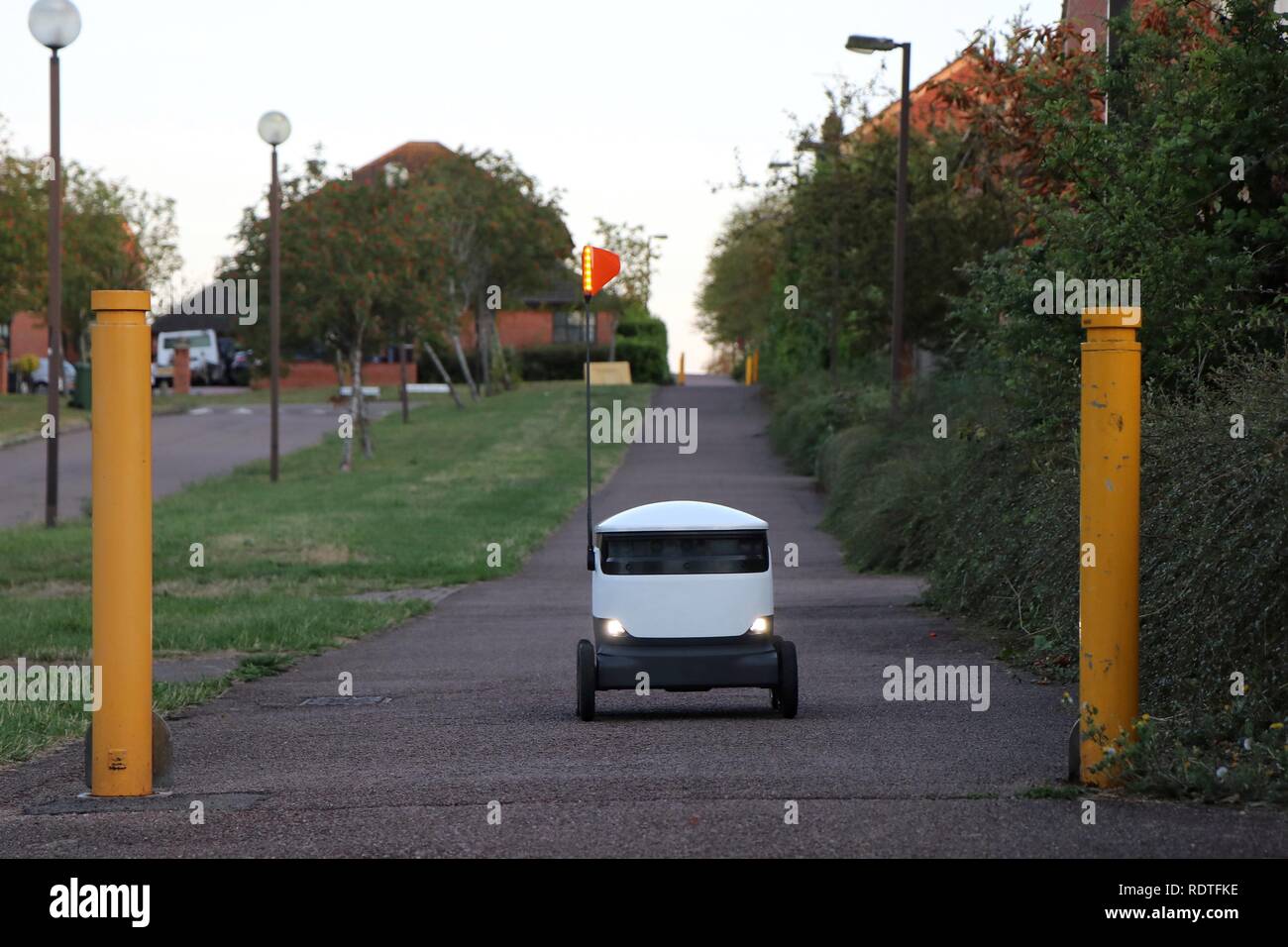 A Starship Technologies delivery robot roams the footpaths in Milton Keynes, delivering groceries from Co-op and Tesco to tech savvy consumers. Stock Photo