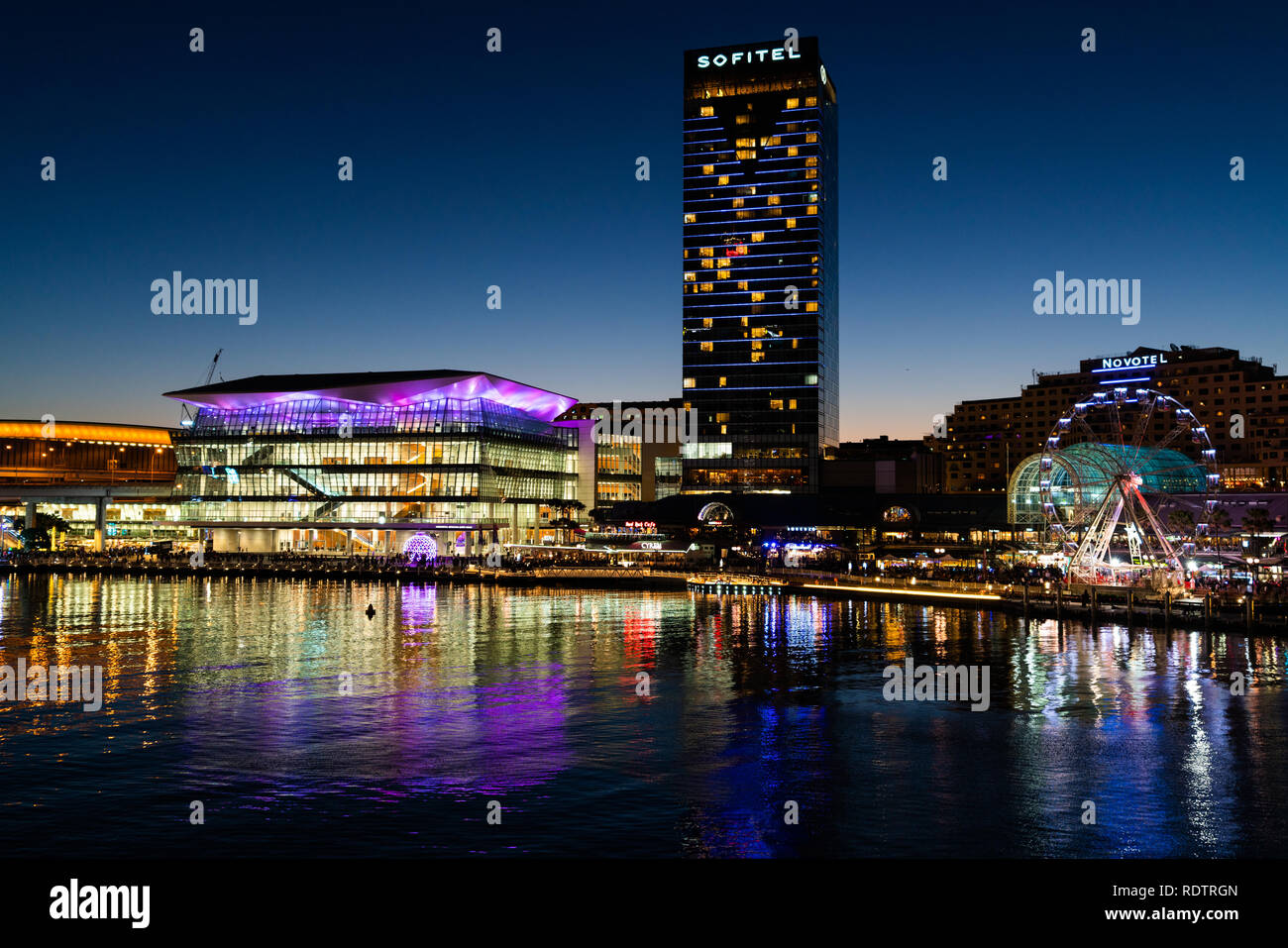23rd December 2018, Sydney Australia: Night view of Darling Harbour with Sofitel hotel and the International Convention Centre in Sydney NSW Australia Stock Photo