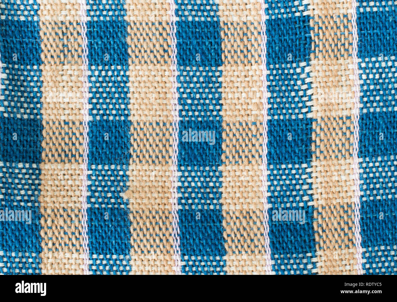 Handmade cotton woven fabric as a background and texture Stock Photo