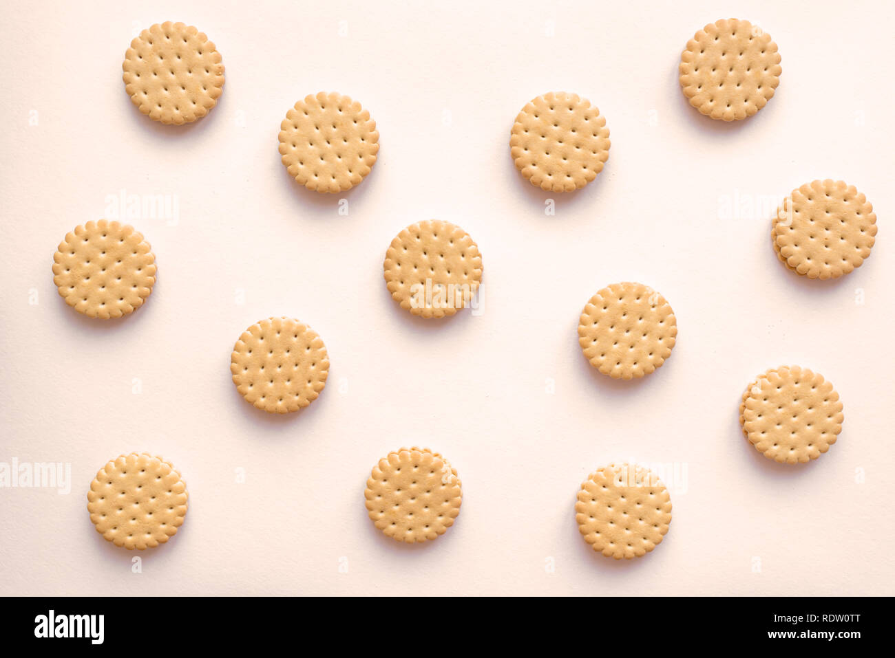 Cookies biscuits crackers flat lay on beige background, top view. Stock Photo