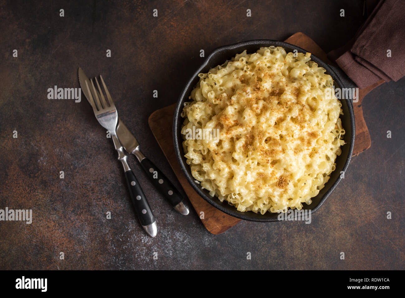 Mac and cheese, american style macaroni pasta with cheesy sauce and crunchy breadcrumbs topping