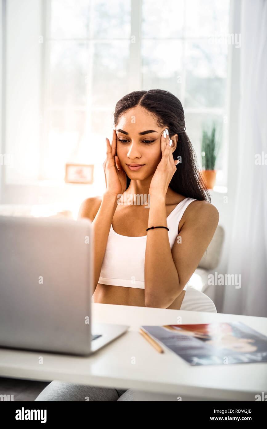 Woman fingers on temples hi-res stock photography and images - Alamy