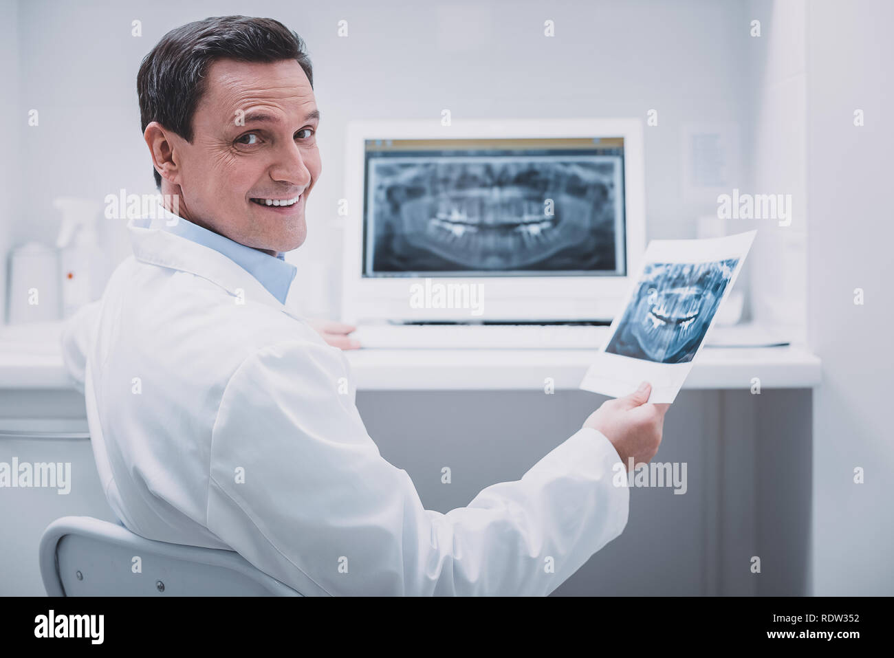 Joyful medical worker looking straight at camera Stock Photo