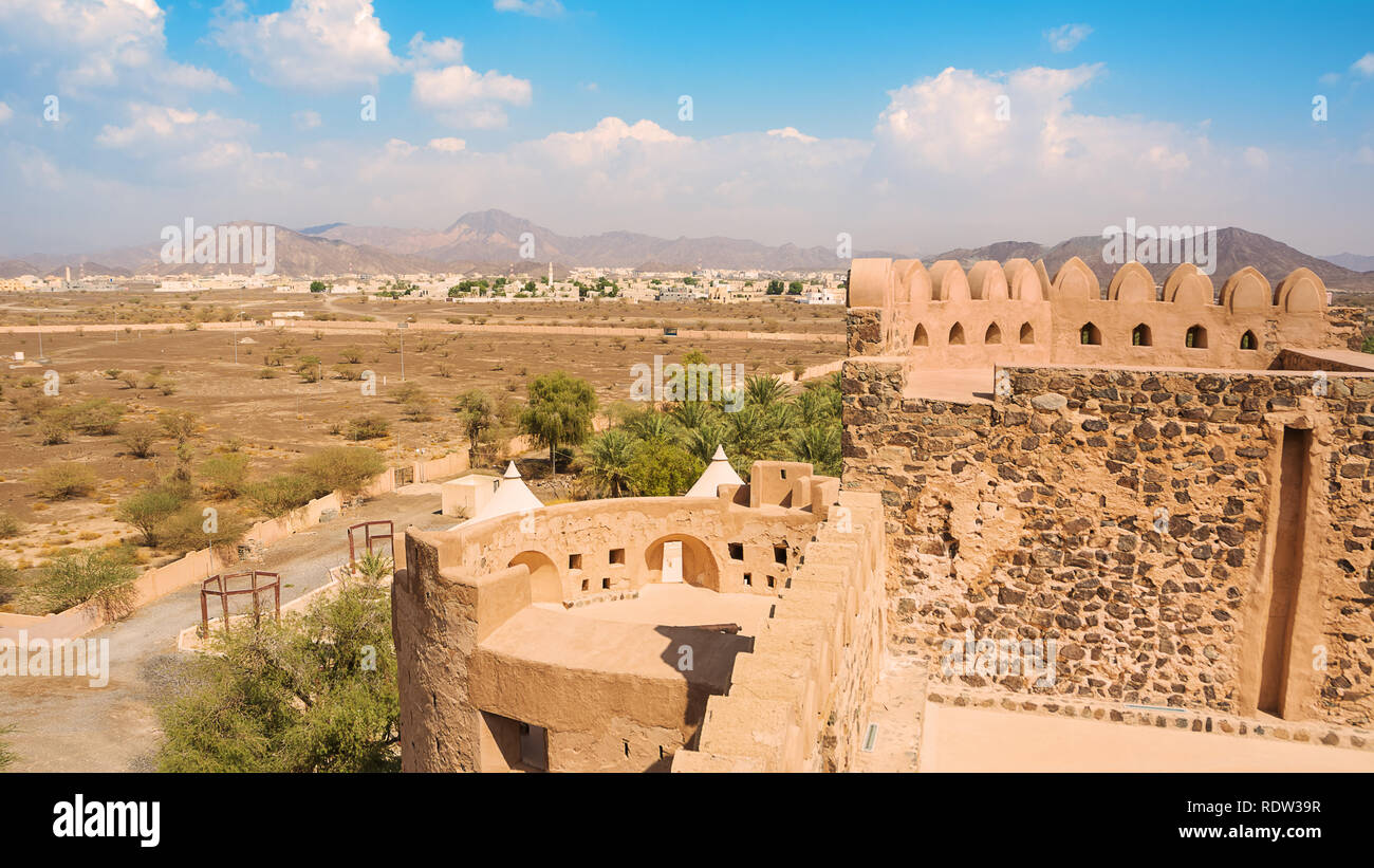 Details of the castle of Jabrin and in the background Bahla and Jebel Shams mountains Stock Photo