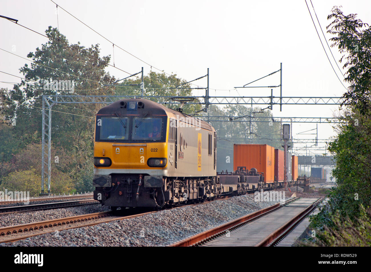 A class 92 electric locomotive number 92022 working an intermodal freight on the West Coast Mainline at Cathiron in Warwickshire. Stock Photo