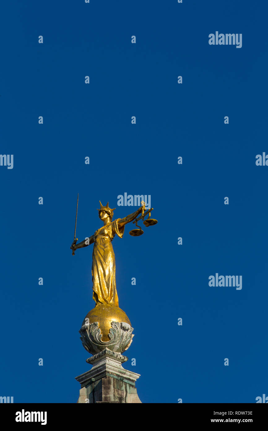 Lady justice statue atop central criminal court hires stock