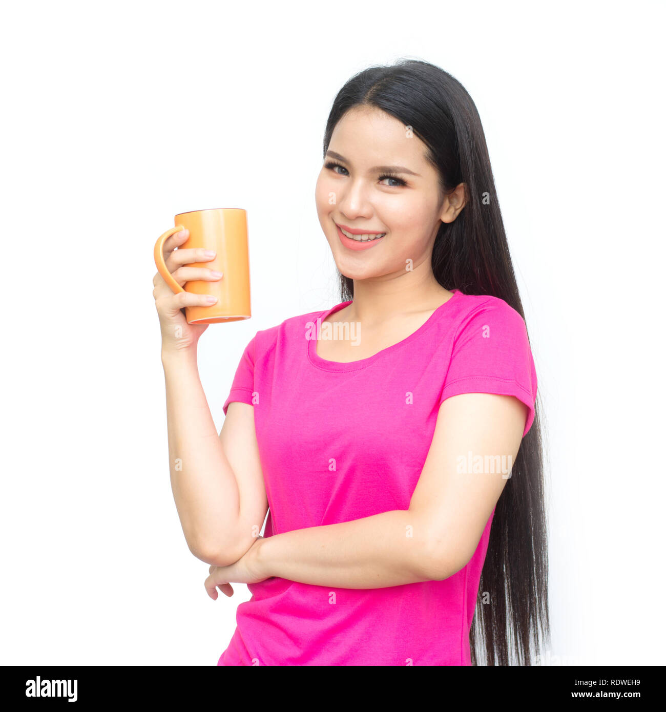 Portrait of asian young woman with cup of tea or coffee isolated on white background. Stock Photo