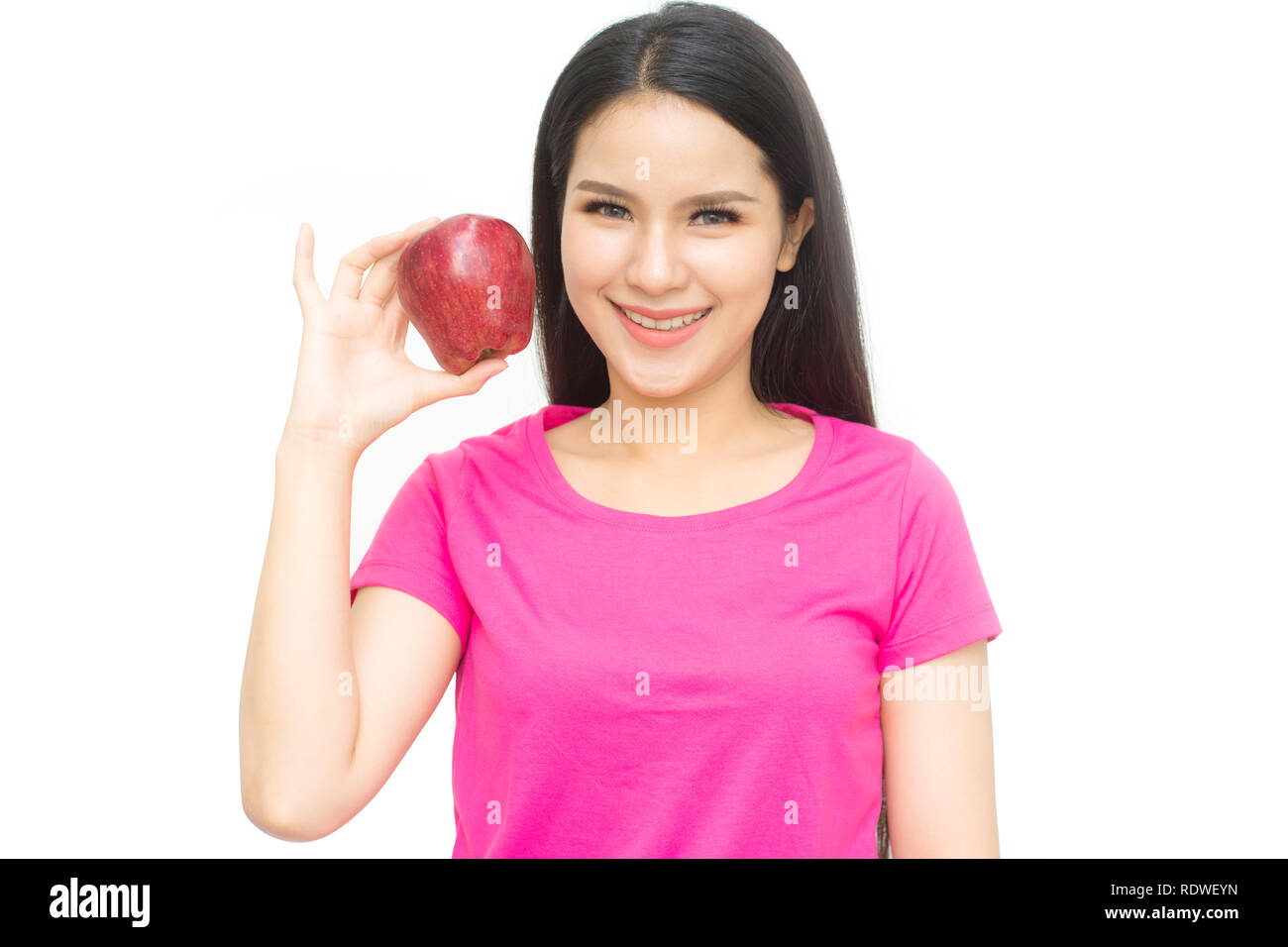 Health girl show red apple with smile face isolated on white background, healthy eating food concept Stock Photo