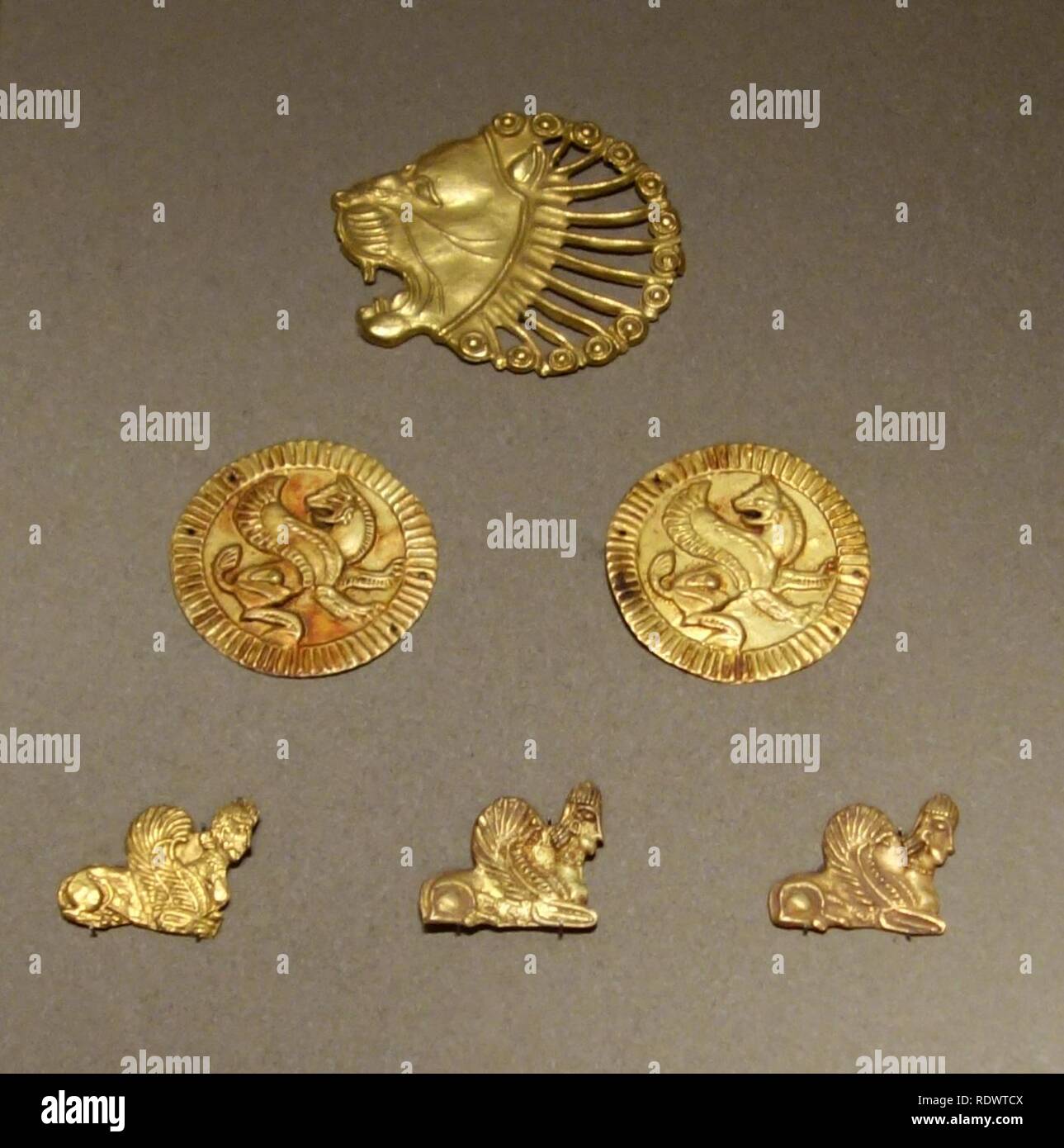 Appliques to ornament courtly costume, Iran, Achaemenid Period, 521-330 BC, gold - Stock Photo