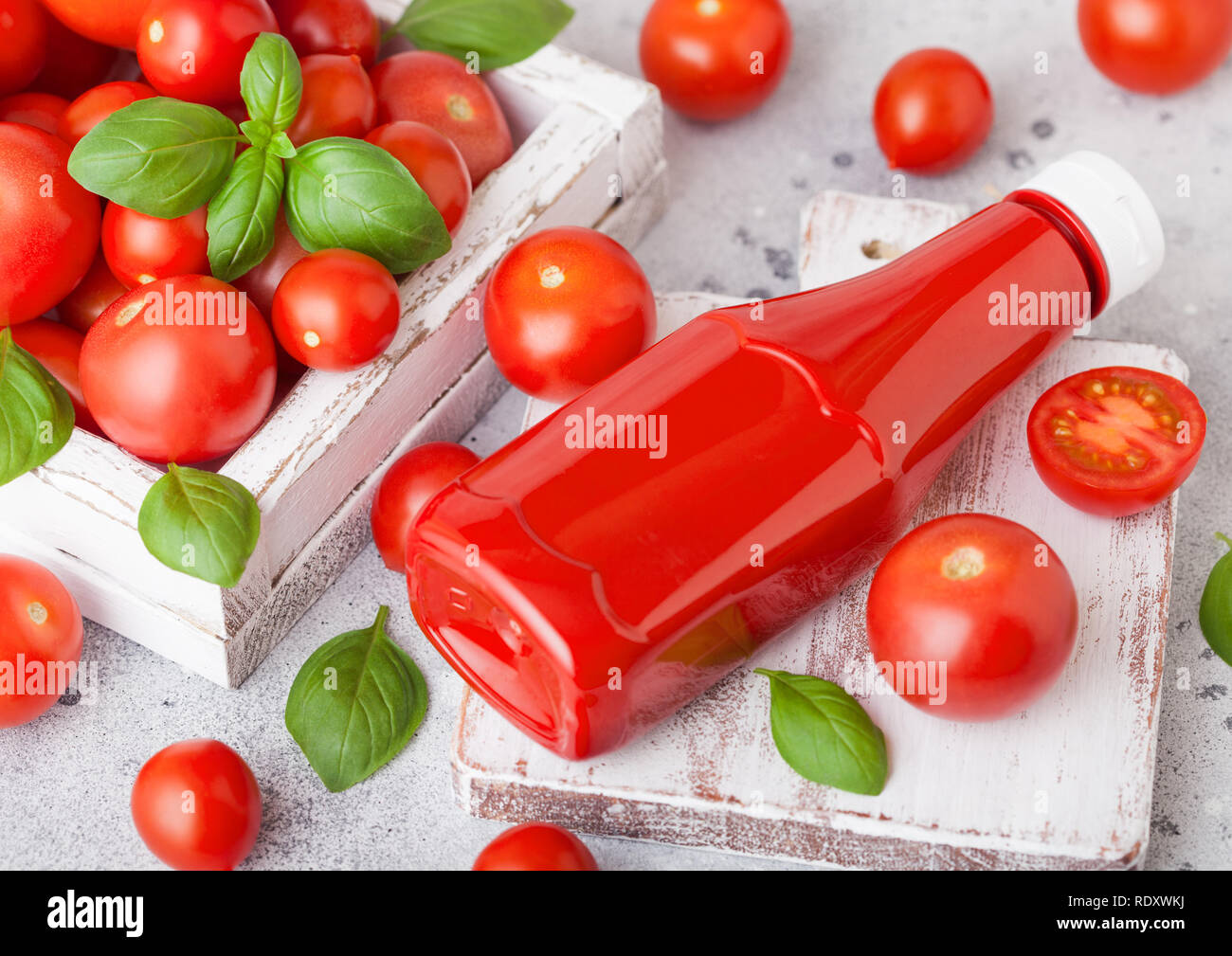 Download Plastic Container With Tomato Ketchup Sauce With Raw Tomatoes On Kitchen Background Stock Photo Alamy