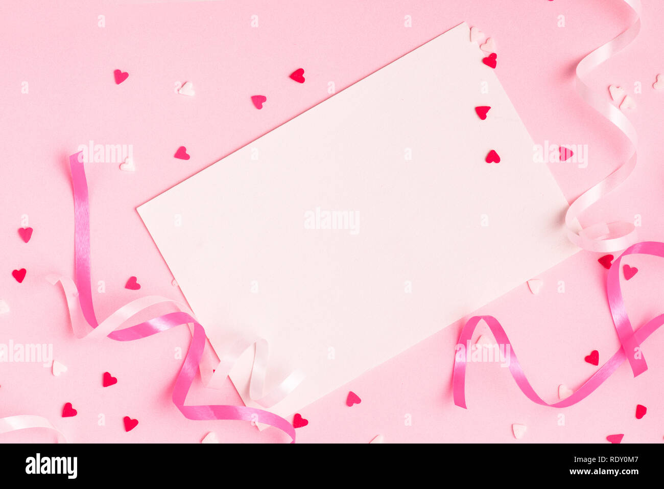 Delicate Pink Party Background With Streamers For Celebrating With Scattered Confetti Stock Photo Alamy