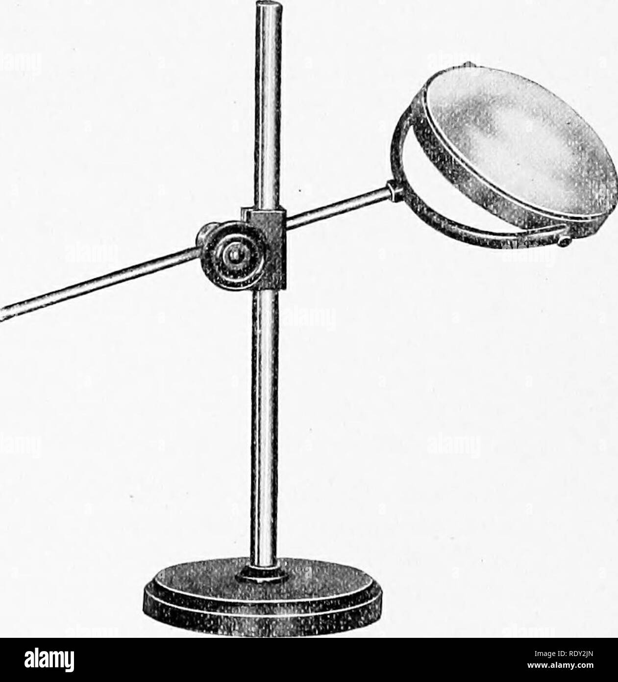 . The microscope : an introduction to microscopic methods and to histology. Microscopes. Fig. 173. Compensation Oculars of Zeiss, with section removed to show the construction. The line A-A is at the level of the upper end of the tube[of the microscope while B-B represents the lower focal points. Zeiss recommends the use of the compensation oculars if one desires a greater magnification than the projection oculars give.. Fig. 174. Bull's eye lens and holder. (Bausch &amp; LomhOpl. Co.). Please note that these images are extracted from scanned page images that may have been digitally enhanced f Stock Photo
