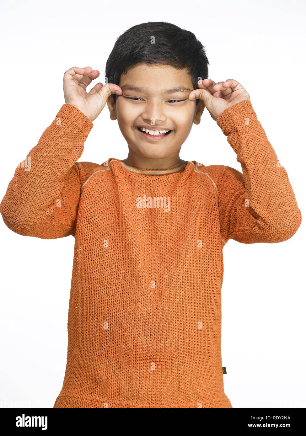 Indian boy making funny face hi-res stock photography and images - Alamy