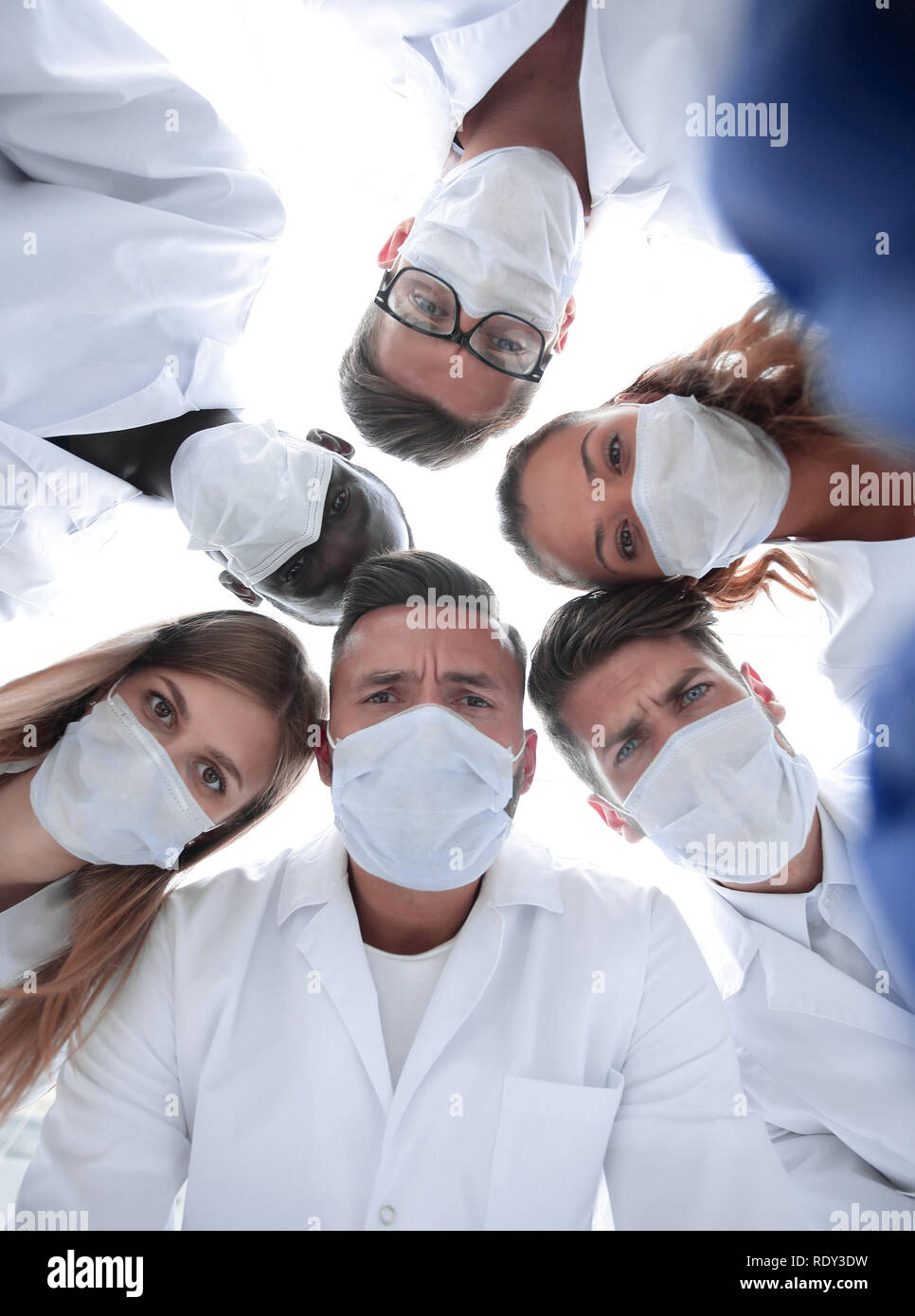 surgeon looking down at patient. Isolated on white Stock Photo - Alamy