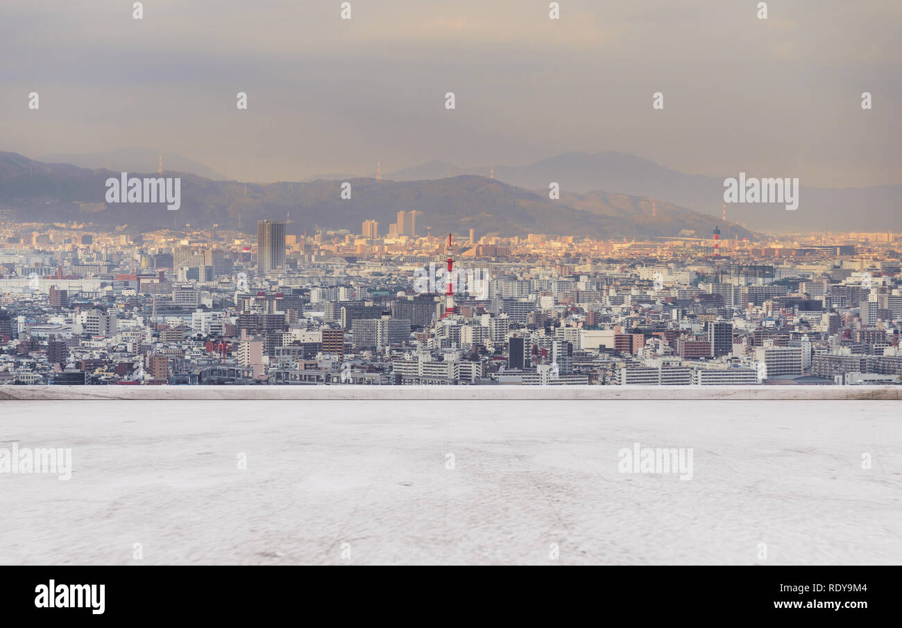 Osaka city skyline, downtown business district in sunset with empty concrete floor Stock Photo