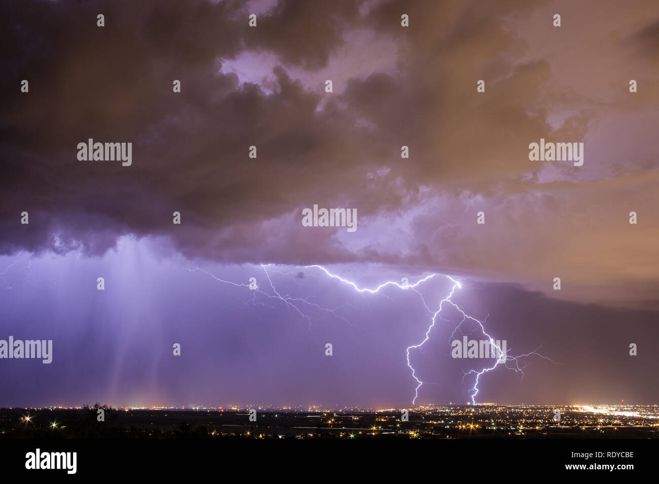 Heavy Rain and Vivid Lightning Pound Las Cruces, New Mexico during the Summer Monsoon Season Stock Photo