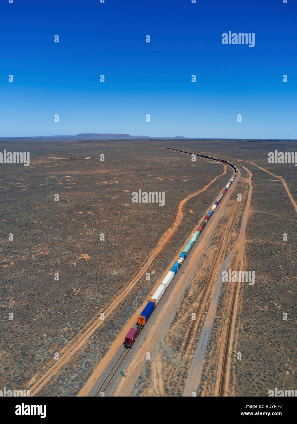 Aerial of freight train heading for