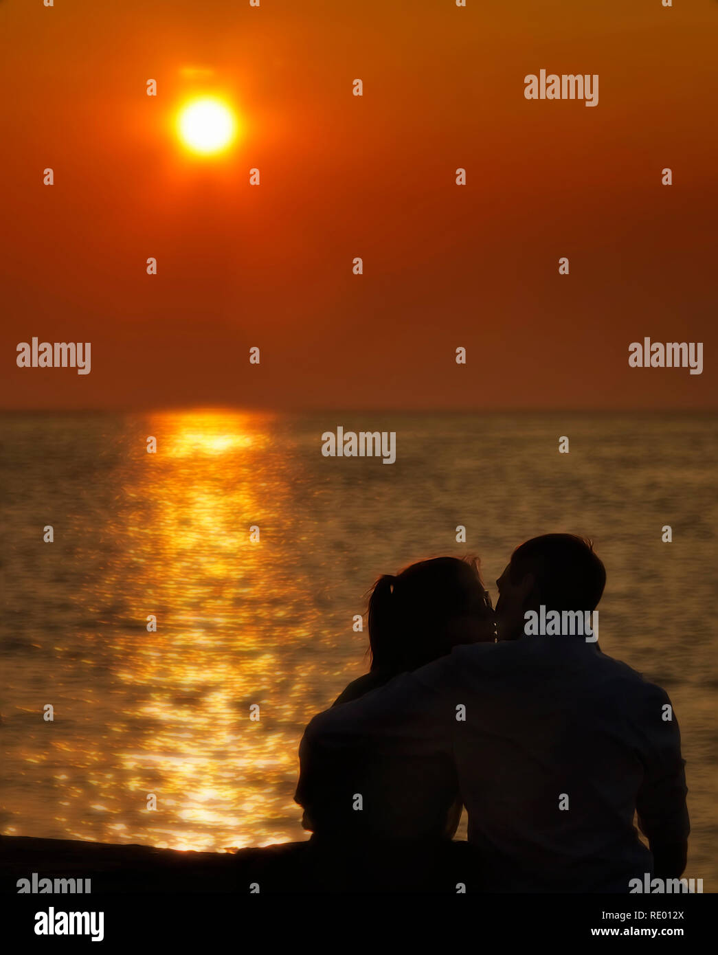 Love and kisses in the sunset. Romantic mood. Stock Photo