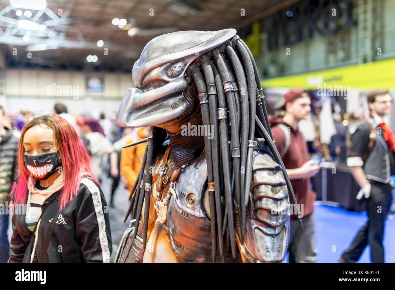 Birmingham, UK - March 17, 2018. Male comicon fan dressed as Twentieth Century Fox character, Predator in cosplay fancy dress at a comic convention. Stock Photo
