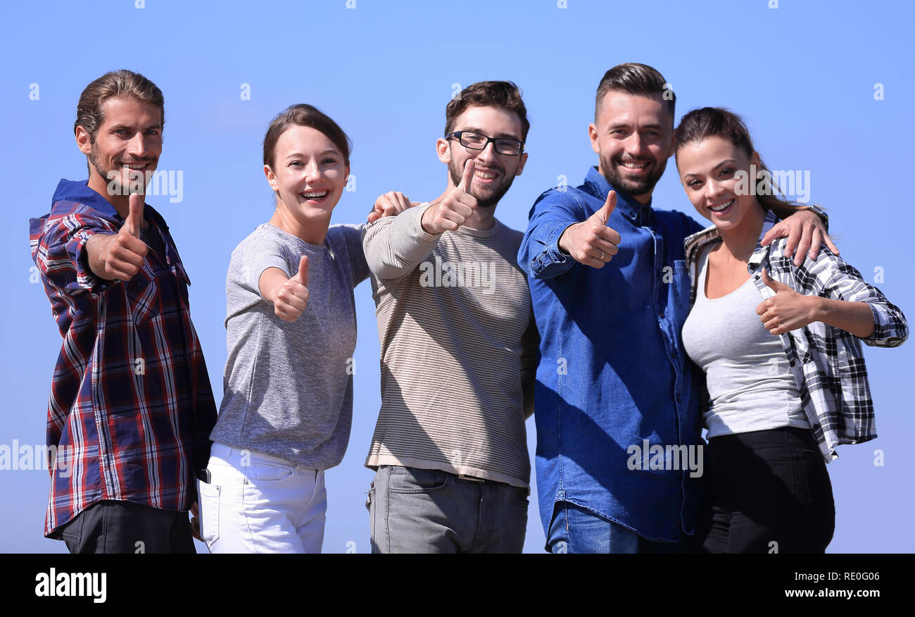 group of young people showing thumb up Stock Photo - Alamy