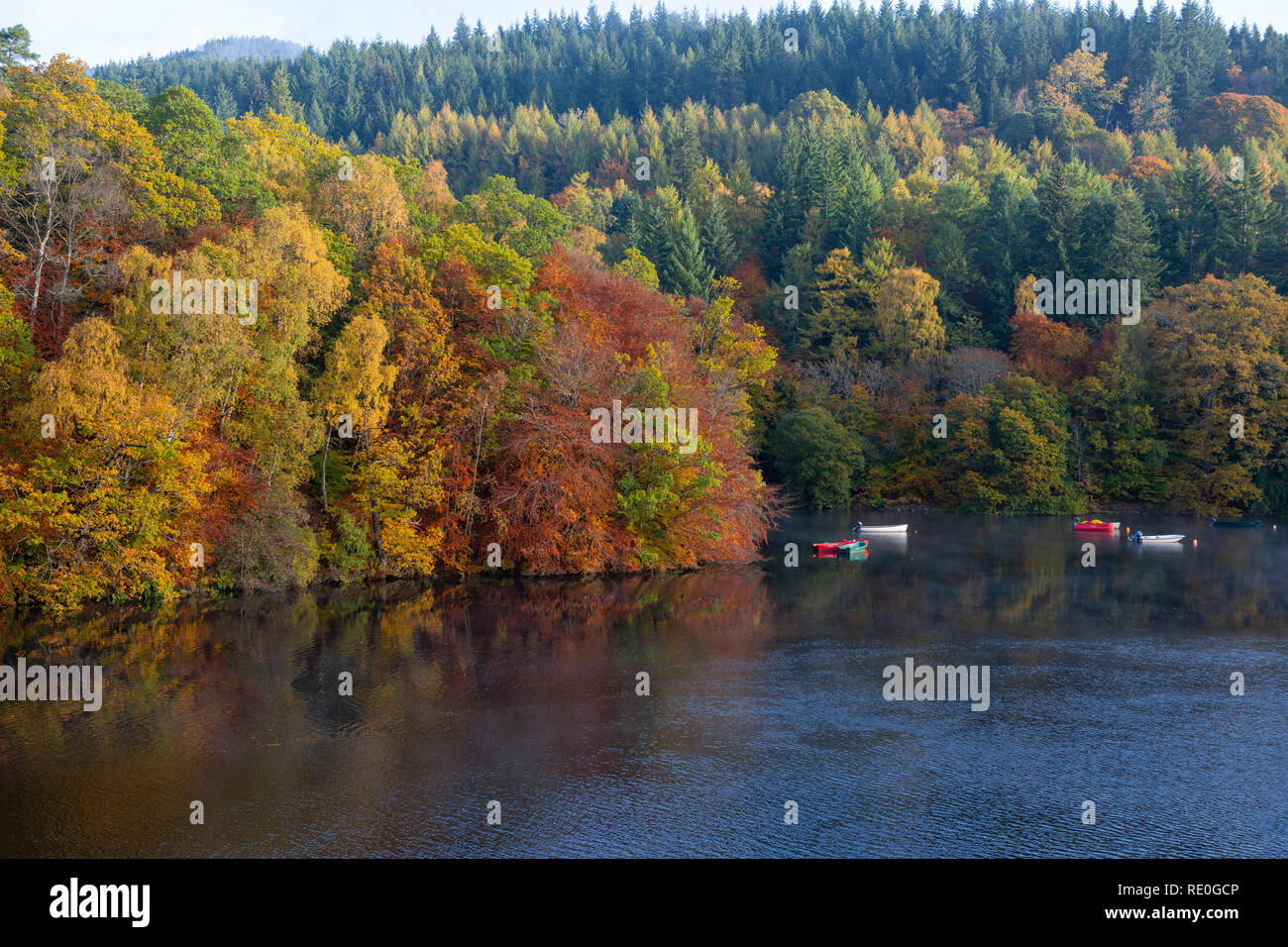 Colourful boats on Loch Faskally near Pitlochry, Perthshire, Scotland Stock Photo
